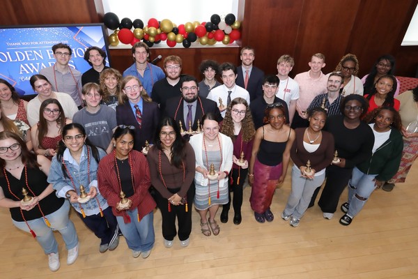 Award recipients pose together with their Golden Bishop trophies.