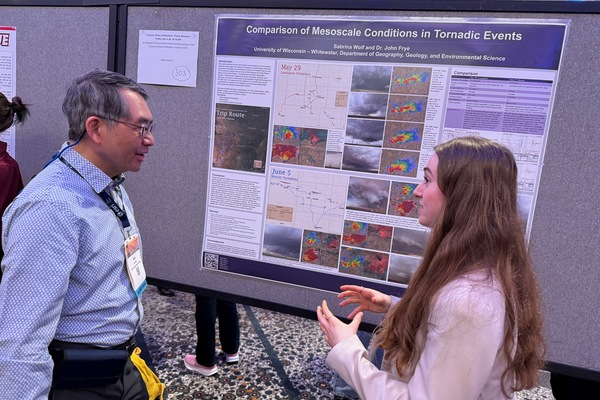 A college student presenting at a conference.