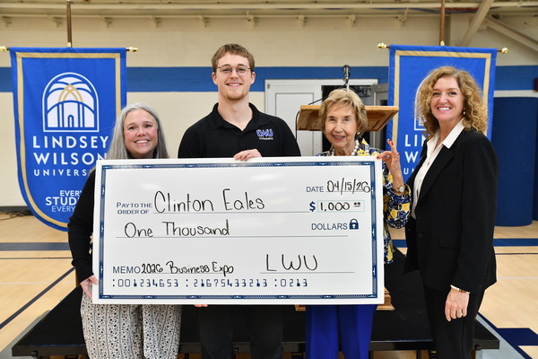 A total of 16 teams of 32 Lindsey Wilson students competed for top recognition at the annual Lindsey Wilson University Entrepreneurship Expo on Wednesday, April 15, in the Doris and Bob Holloway Health & Wellness Center. Taking first place and a $1,000 cash award was junior Clinton Eales, second from left, of South Africa for his concept, The Ripple Effect. Also pictured are event coordinators Lindsey Wilson business faculty members Cathy Boatright, Linda McKinley-Grider and Jennifer Crawley.
