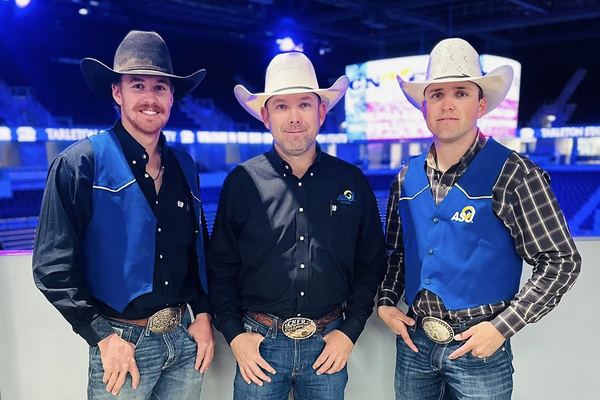 Angelo State Rodeo Team members Caleb Lake and Sam Lewis posed with ASU Rodeo Coach Casey Sisk