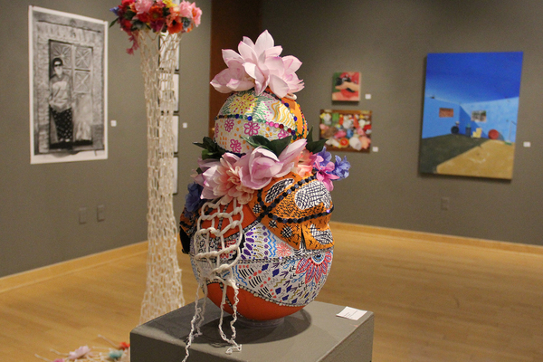 Works by eight Monmouth College senior art majors are currently on display in the Len G. Everett Gallery in Hewes Library.