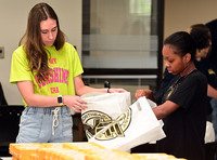 Northeast Mississippi Community College Iota Zeta chapter of the Phi Theta Kappa honor society members pack cheese order