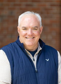 John Finnegan poses for a portrait in the Academic Quad at SUNY Potsdam.