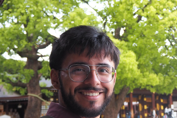 man in glasses smiling