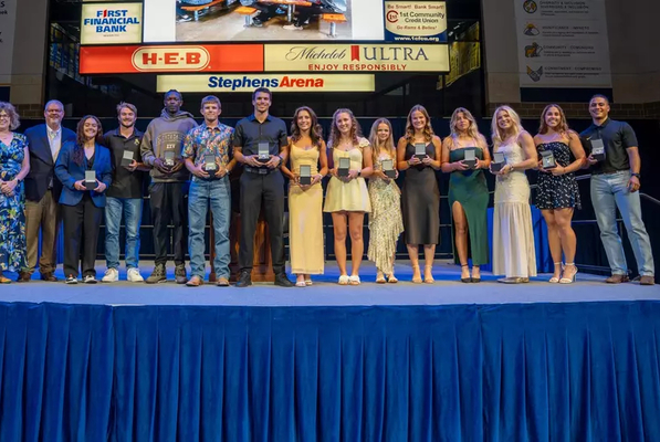 Angelo State's 2026 Holland's Awards winners lined up on stage holding their awards