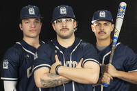 Three SUNY Canton student-athletes in their blue baseball uniforms. 