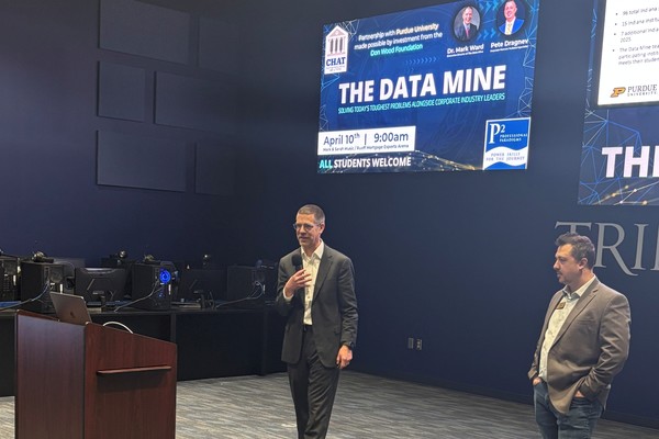 Mark Ward, Ph.D., left, executive director of the Data Mine, and Pete Dragnev, corporate partners technical specialist, speak to Trine University students on April 10. (Photo by Michael Smith / Trine University)