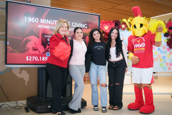 President Britt Rios-Ellis, students and campus mascot Titus celebrate the momentum and community spirit of 1960 Minutes of Giving, which raised more than $270,000 to support student success.