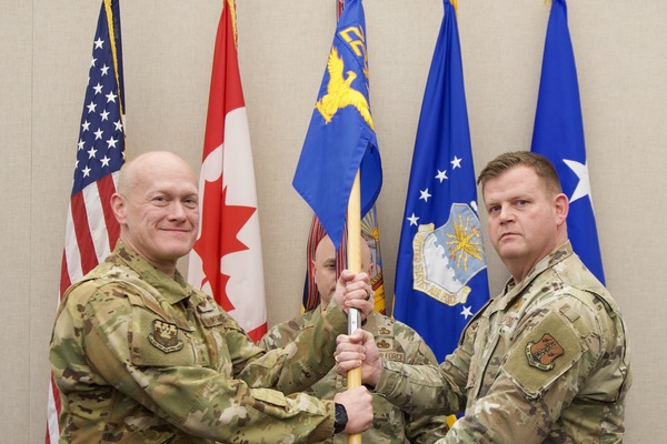 New York Air National Guard Col. Joseph Miller, right, accepts the guidon of the 224th Air Defense Group on Major General Gary Charlton II, the commander of the New York Air National Guard during change-of-command ceremonies at Eastern Air Defense Sector.Headquarters in Rome, New York on April 23, 2025. The 224th Air Defense Group's 368 Airmen carrying out the air defense mission of the Easter Air Defense Sector . ( U.S. Air National Guard photo by Barbara Olney)