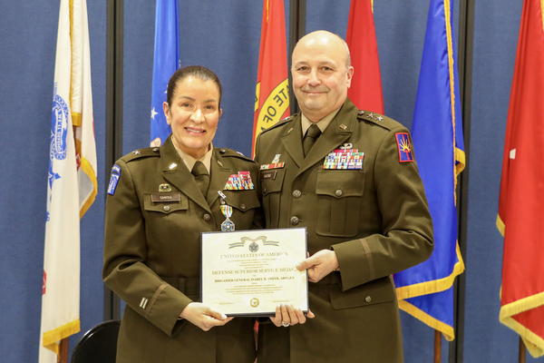 Army Brigadier General Isabel Rivera Smith, the director of joint staff for the New York National Guard is awarded the Defense Superior Service Medal by Major General Michel Natali, the assistant adjutant general, Army, during her retirement ceremony on April 24, 2026 at New York National Guard headquarters in Latham, New York. Smith, who enlisted in the Army as a truck driver in 1985, has over 40 years of military service. (U.S. Army National Guard photo by Stephanie Butler)