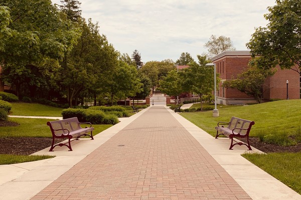 The photo shows a large expanse of Ohio Wesleyan's JAYwalk, a brick pathway running through the center of campus. 