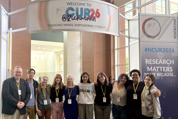 Dr. Christopher Mitchell (left), Associate Dean of the College of Liberal Arts and Sciences and Professor of Theatre at Eastern Illinois University, accompanied nine EIU students to the National Conference on Undergraduate Research (NCUR) in Richmond, Virginia, where students from numerous higher education institutions representing a multitude of disciplines are encouraged to share their work.