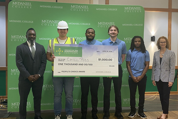 McDaniel College student winners of the People's Choice Award Innovation and Entrepreneurship Challenge holding their prize, a $1,000 check.