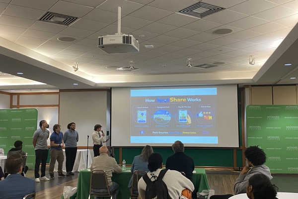 Students from the SpotShare group delivering their presentation.