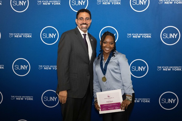 SUNY Potsdam student Sadie Brown ’26 (right) was honored with the 2026 Norman R. McConney Jr. Award for EOP Student Excellence by SUNY Chancellor John B. King, Jr.