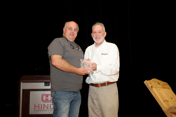 Hinds Community College President Dr. Stephen Vacik, right, presents Marvin Moak, Hinds Community College Vice President of Facilities and Auxiliary Services, with Hinds’ highest honor – the 3E Award – Emphasis on Excellence and Enrichment – during Spring Employee Appreciation festivities on April 24. Moak, a Raymond resident, has worked for Hinds in various capacities since 2000.   