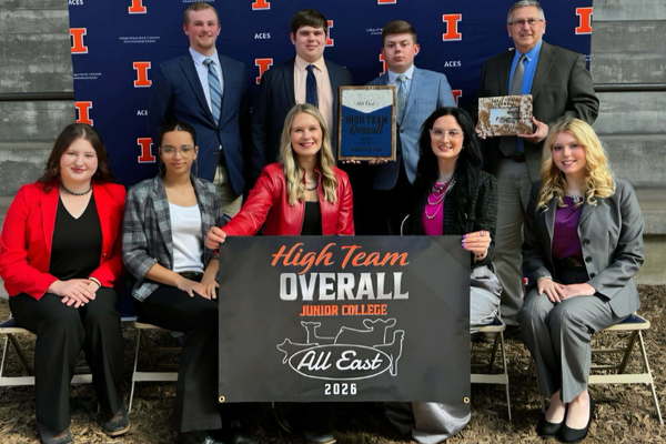 ICC Livestock Judging Team holding a High Team Overall banner