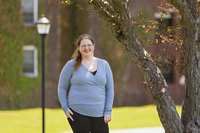Sarah Dauenhauer poses for a photo in the Academic Quad at SUNY Potsdam.