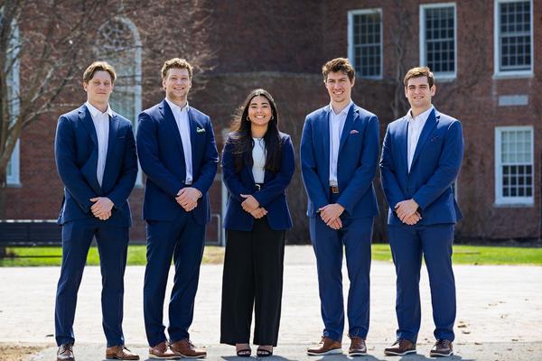 From left, Andrew Gubbins, Jakub Hall, Gabriella Luna, Jack McCandless and Benjamin Presley pose for a photo in SUNY Potsdam’s Academic Quad. The team took home a trophy for competing virtually at the Intercollegiate International Business Ethics and Sustainability Case Competition.