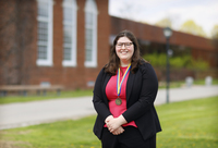 Molly Collins poses with her Chancellor's Award medallion on the Academic Quad.