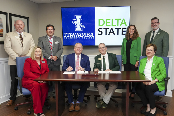 Leaders from Itawamba Community College and Delta State University pose following the signing of two memorandums of understanding on the Fulton Campus. Front row, from left, are Michelle Clouse, vice president of instructional services at ICC; Jay Allen, ICC president; Dan Ennis, DSU president; and Leslie Griffin, provost and vice president for academic affairs at DSU. Back row, from left, are Chris Stevenson, dean of academic instruction at ICC; Chris Cox, education department lead at ICC; Merideth Van Namen, dean of the College of Education at DSU; and Jeffrey Leffler, associate provost and vice president for academic affairs at DSU. Photo by CJ Adams, ICC Community Relations. 