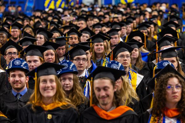 A large crowd of UAF graduates in caps and gowns fills the Carlson Center during the 104th commencement ceremony in May 2026.