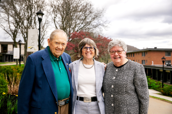 SUNY Delhi President Mary Bonderoff (center) with John Brooks '67 (left) and his wife Joan Brooks (right) on the SUNY Delhi campus after the naming of the Brooks Family Welcome Center in Alumni Hall.