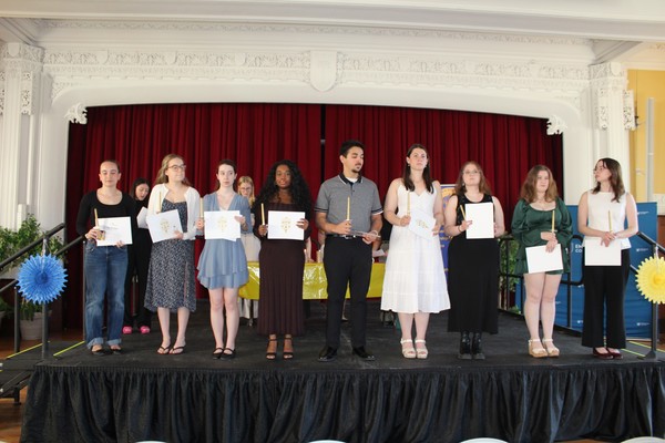 Representation of the achievement named ' Emmanuel Inducts 9 to Alpha Phi Sigma honor society '.