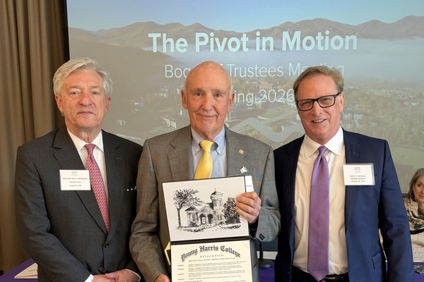 Bill Johnston, left, chairman of the Board of Trustees, and Kurt Momand, right, Trustee member, present Jon Anderson with the YHC Medallion Award.