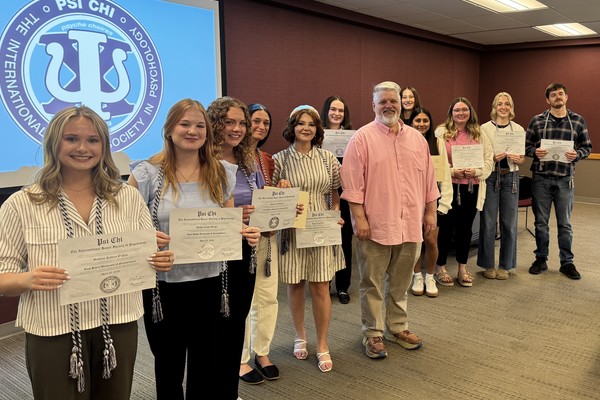 Shown, from left, are Psi Chi inductees Madeline O’Neil, Alyssa Weigle, Jaelyn Bradley, Faith Persing, Abagail Butler, Madison Tolomay, Dr. Scott Carnicom, Riley Wharton, Salma Villamorales, Madelyn Crawford-Randow, Payton McCully and Emmett O’Neill. Not pictured: Tyler Clawson, Aaron Eldred, Adia Grinnell, Kaylee Hart, Evie Rembold, Jace Szaflarski and Allison Weaver.