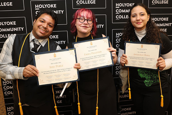 HCC students holding PTK certificates