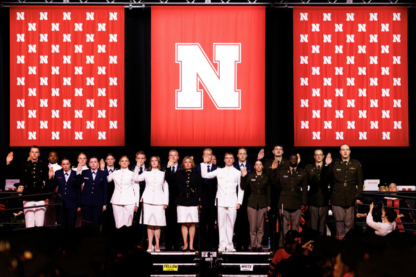 ROTC members in uniform recite the oath of enlistment onstage at PInnacle Bank Arena.