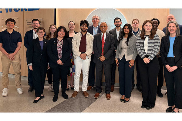 Recipients of the SUNY Chancellor's Award for Student Excellence stand for a photo with UB leadership.