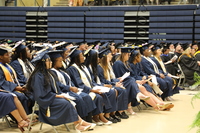 Several graduates sitting in the first two rows during commencement services.