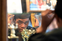 Graduate, adjusting hat, mirror