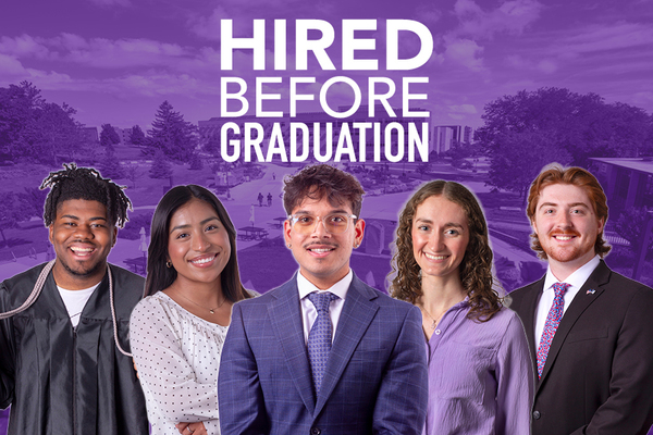 A group of college students posed with the words HIRED BEFORE GRADUATION above them.