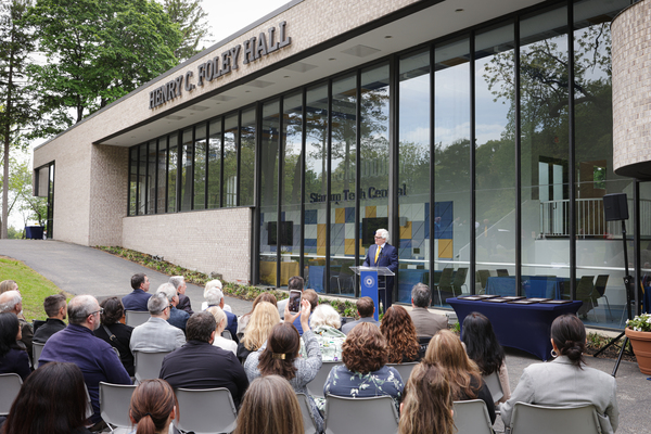 New York Institute of Technology President Emeritus Henry C. "Hank" Foley speaking at the dedication of Henry C. Foley Hall on the university's Long Island campus. 