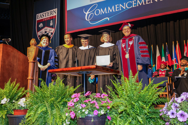 Honorary degree recipients David and Marilyn Foster, surrounded by Provost and VP for Academic Affairs Cheryl Wilson, BOR regent Theodore Yang, and President Karim Ismaili