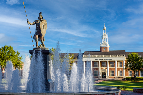 A photo of the fountain on the academic quad with John Robert Lewis Hall in the background.
