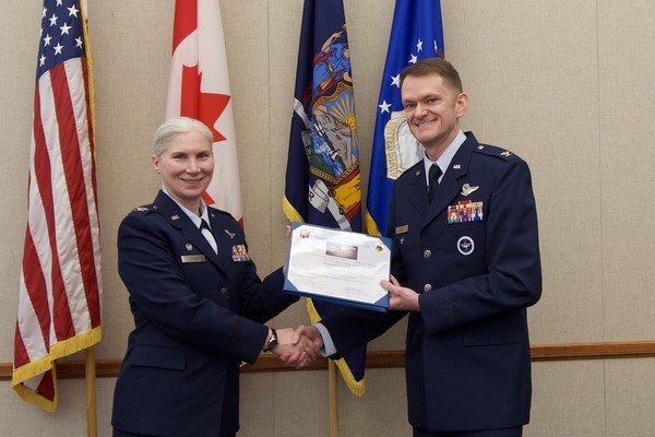 Colonel Joseph F. Roos a Manlius resident who commanded the Rome-based Eastern Air Defense Sector, receives a retirement award from Col. Jennifer King, who replaced him as EADS commander, during his retirement ceremony on May 12, 2026 at EADS headquarters in Rome, New York. U.S. Air National Guard photo by Barbara Olney)