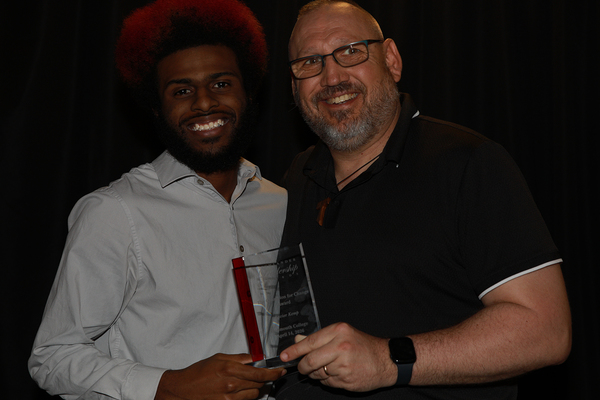 ZAY KEMP: He was nominated for the Champion for Change award he's receiving here by the Rev. Dr. John Huxtable (right), Monmouth's chaplain.