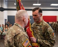 Officers transferring colors during change of command. 