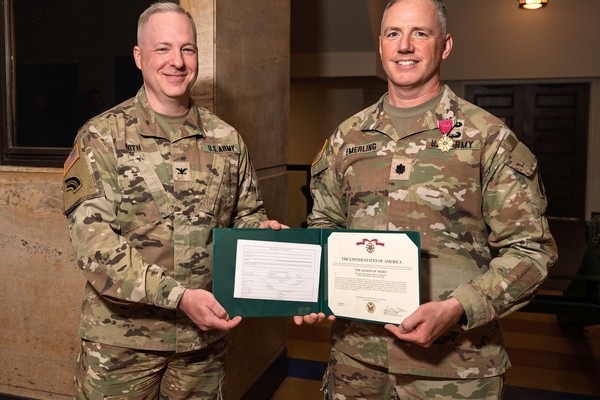 New York Army National Guard Lt. Col. Eric Emmerling, right, receives the Legion of Merit from Col. Jeffery Roth, commander of the 42nd Infantry Division Artillery, during Emmerling's retirement ceremony on May 16, 2025 at the New York National Guard's Jamaica Armory. Emmerling, a Springville resident, is retiring after 20 years of military service.(U.S. Army National Guard photo by Sgt. 1st Class Sebastian Rothwyn)