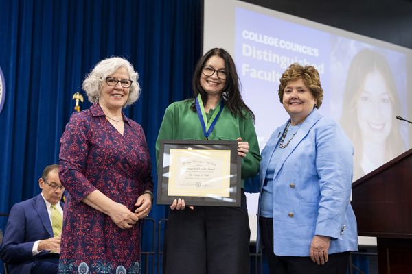SUNY Canton Associate Professor Barat Wolfe, Ph.D., center, received the SUNY Canton College Council 2026 Distinguished Faculty Award.