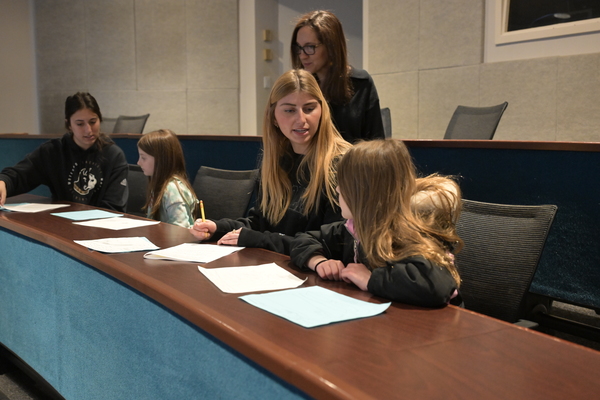 Representation of the achievement named 'Students conduct research on youth perspectives '.