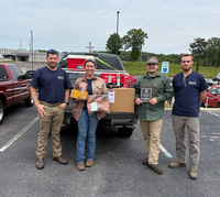 4 CCTC representatives photographed with welding competition awards