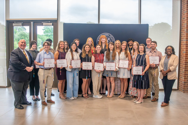 group of Mississippi State students with award certificates