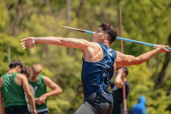 Student-athlete throws a javelin