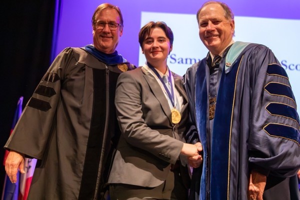 Representation of the achievement named 'Samuel M. Scott Wins Highest Honor at Hartwick College'.