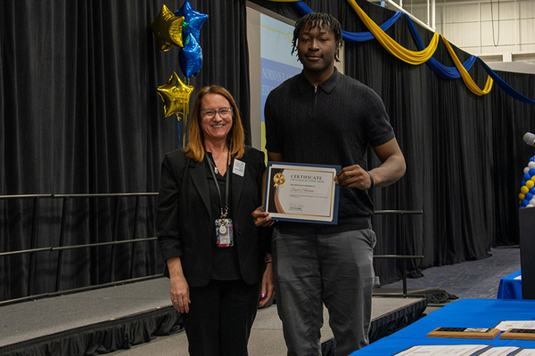 Norman R. McConney, Jr. Award for Student Excellence recipient Said Adam with Associate Dean of Students and EOP Coordinator Tanya Lane-Herbert